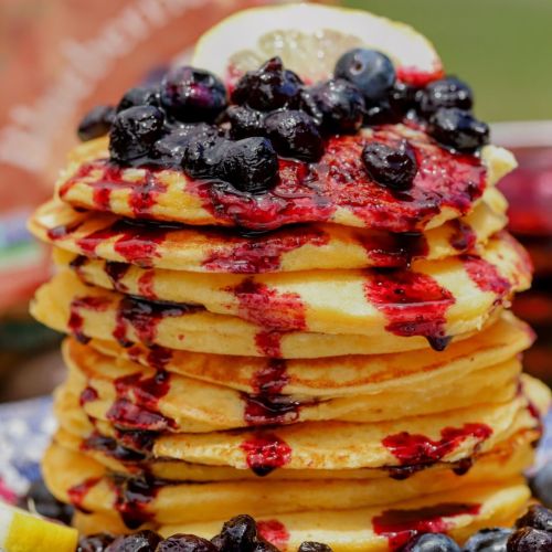 stack of lemon ricotta pancakes with blueberry compote made with Stahlbush Island Farms Blueberries
