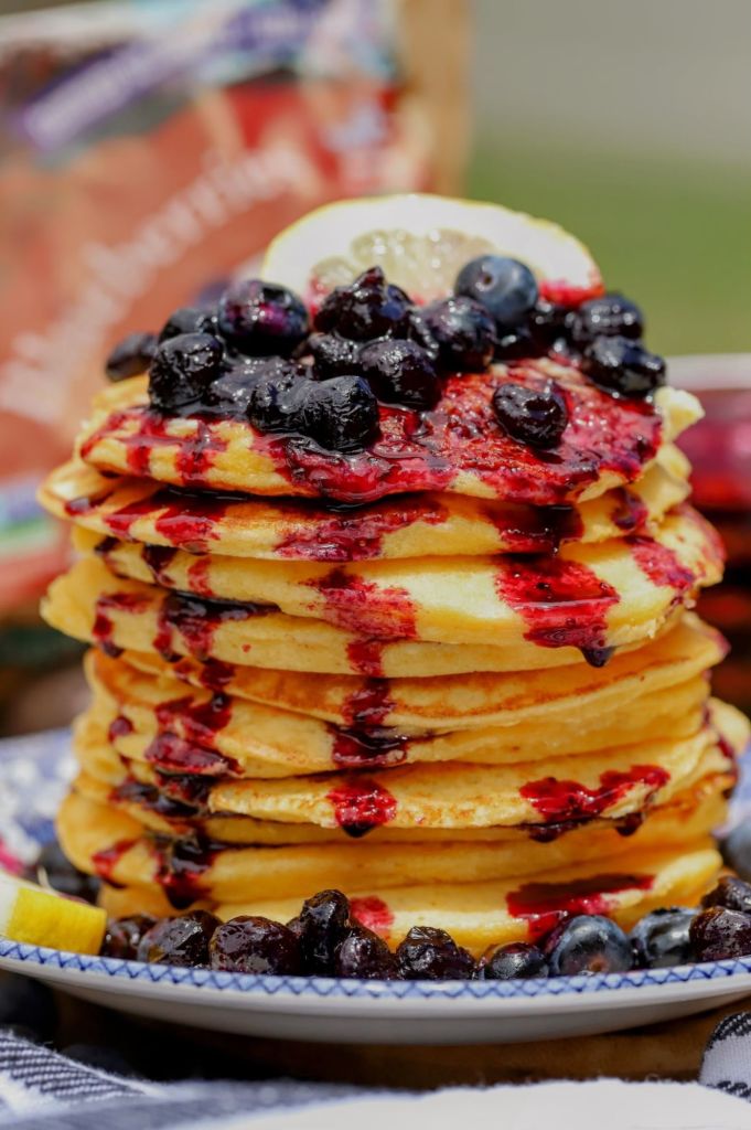 stack of lemon ricotta pancakes with blueberry compote made with Stahlbush Island Farms Blueberries