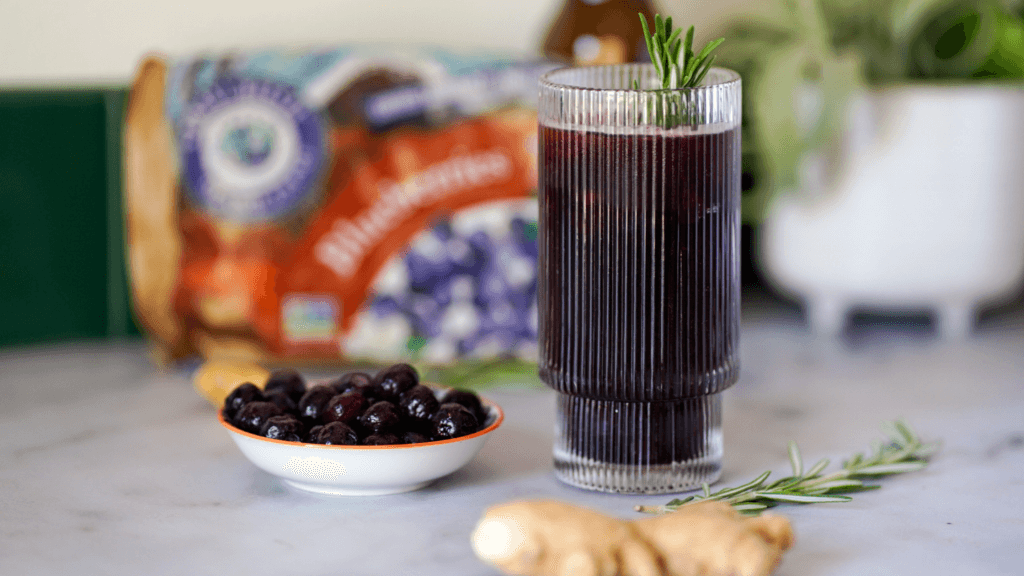 sparkling blueberry ginger mocktail in a cocktail glass