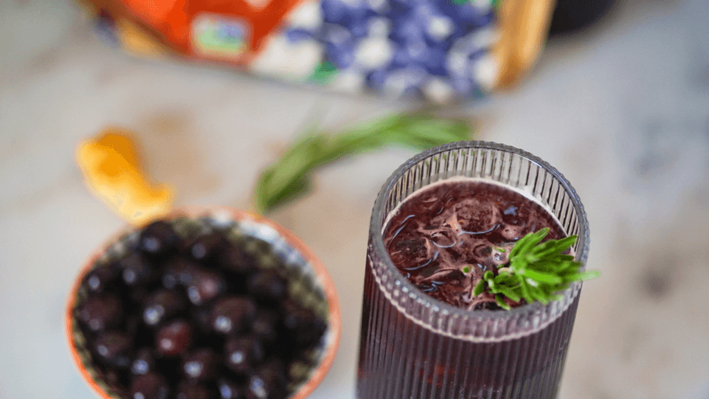 sparkling blueberry ginger mocktail in a cocktail glass