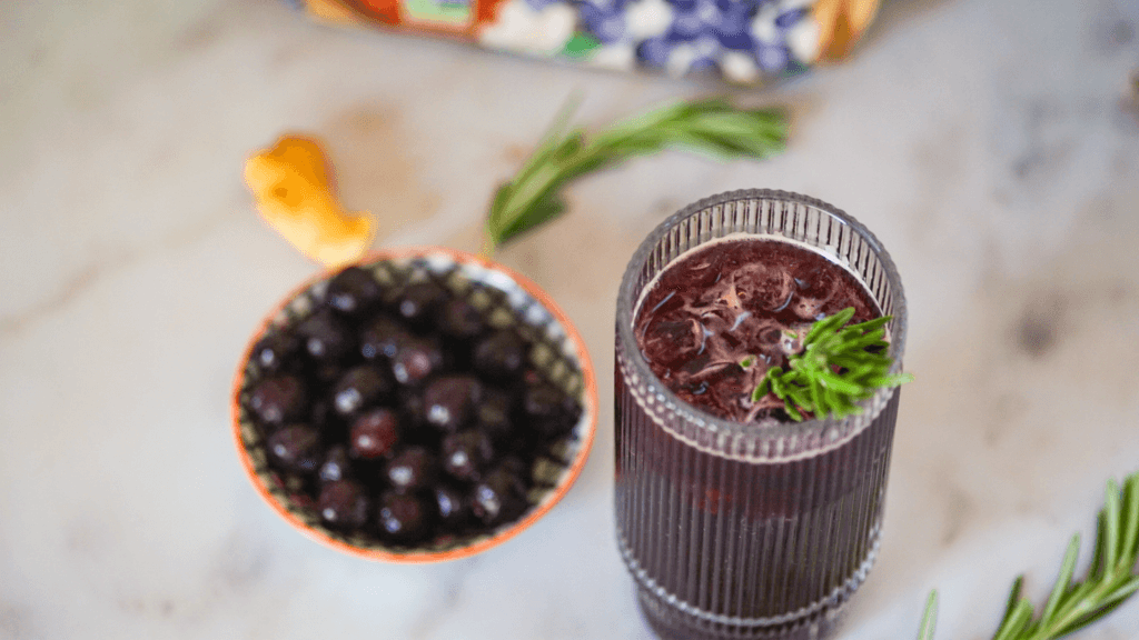 sparkling blueberry ginger mocktail in a cocktail glass