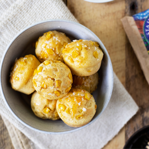 A bowl of honey cornbread muffins