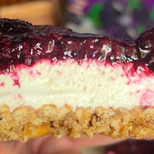 a close up shot of a blackberry pretzel salad bar