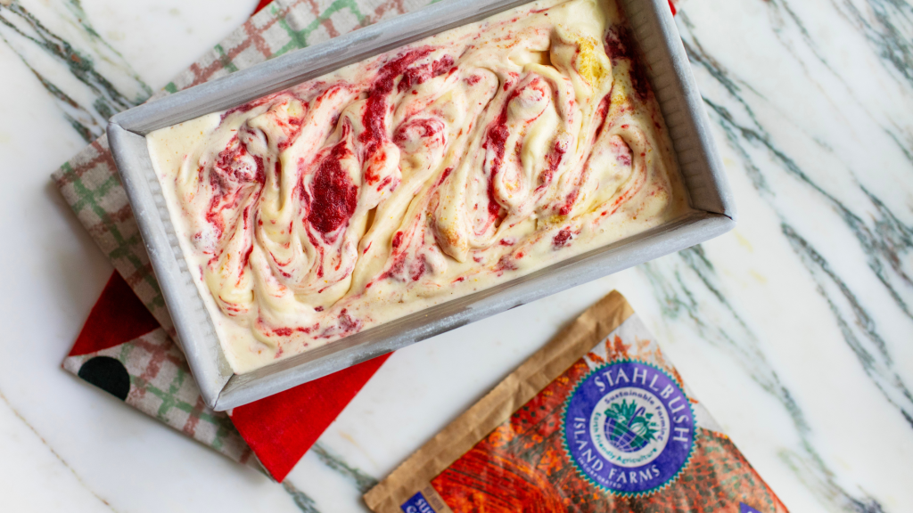 a container of strawberry cheesecake ice cream and a bag of Stahlbush Island Farms strawberries