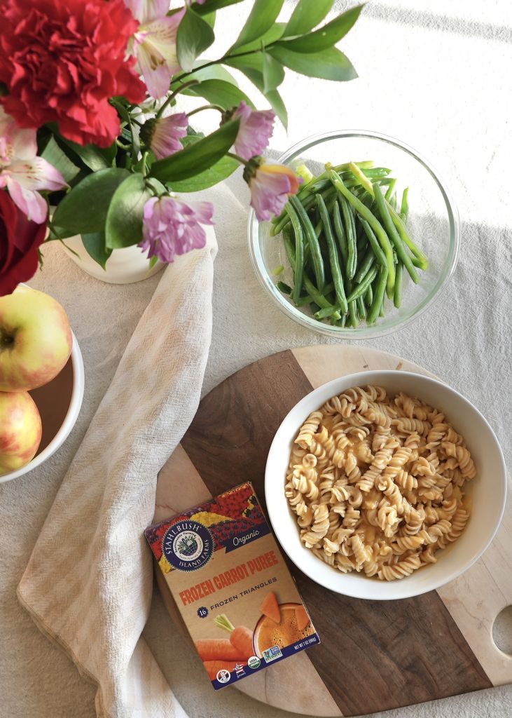 a bowl of pasta and a box of Stahlbush Island Farms Frozen Organic Carrot Puree Triangles