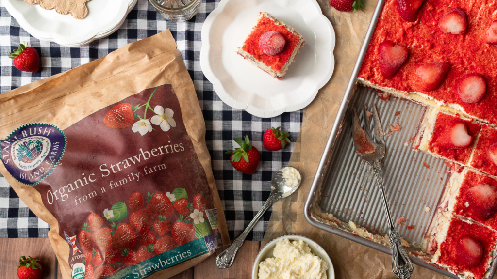 a slice of strawberry tiramisu and a bag of frozen organic strawberries from Stahlbush Island Farms