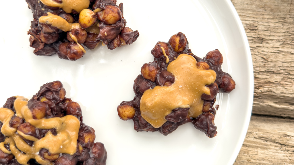 a plate of chocolate peanut butter chickpea clusters