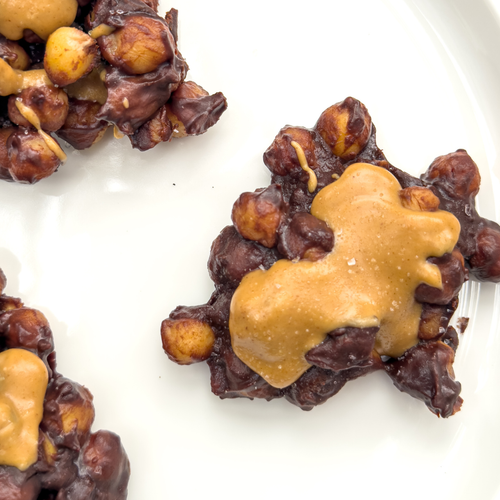 a plate of chocolate peanut butter chickpea clusters