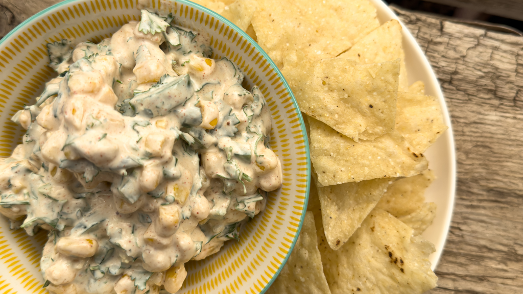 a bowl of street corn dip made with Stahlbush Island Farms' Frozen Super Sweet Corn